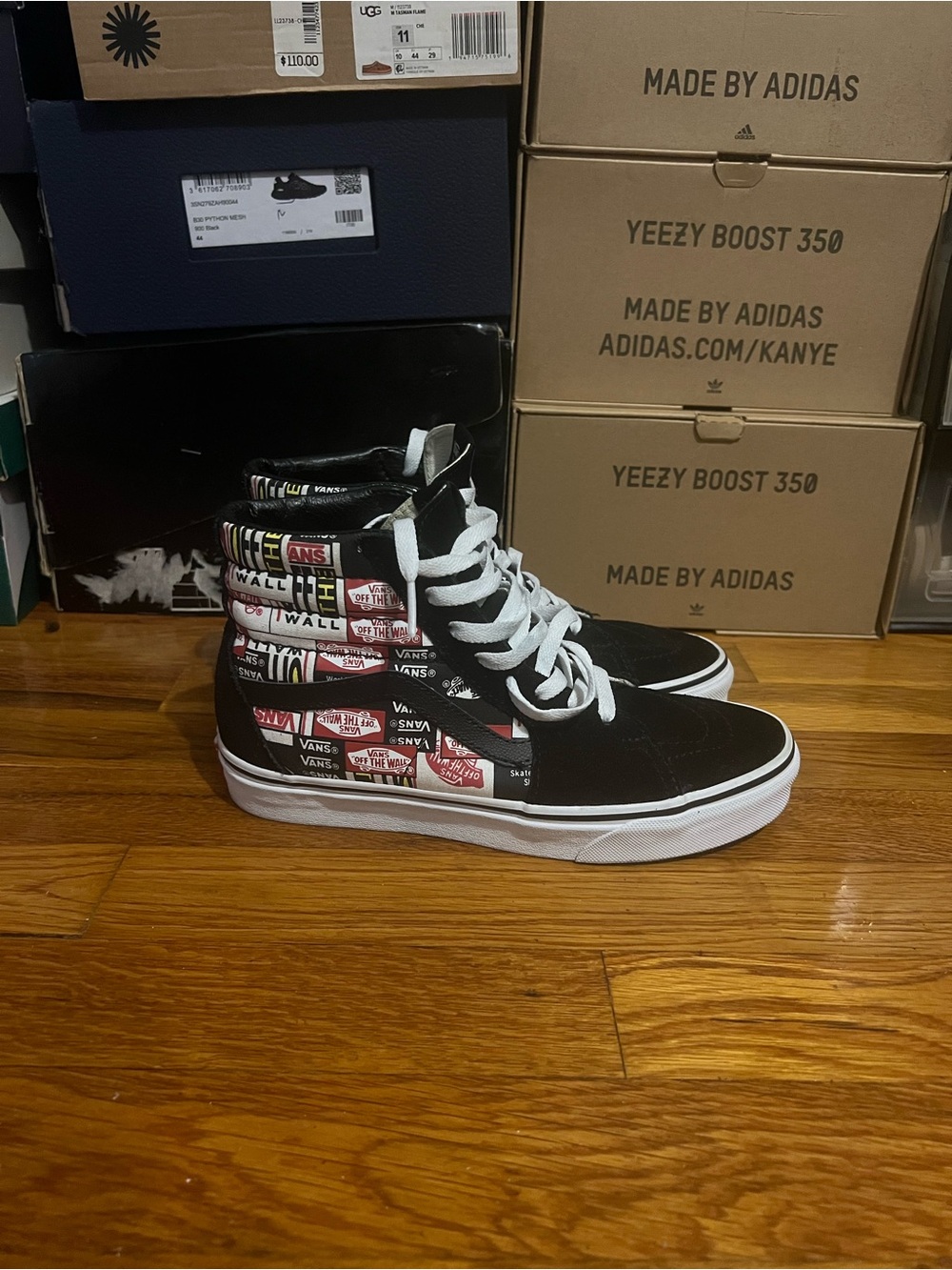 Vans women’s 7.5 High-Top Skate Shoes in Black with Graphic Panels